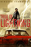 Image shows the cover of Trail of Lightening which features a young woman dressed in black standing on stop of a red car driven by a young man. She holds a gun and lightening plays around her.
