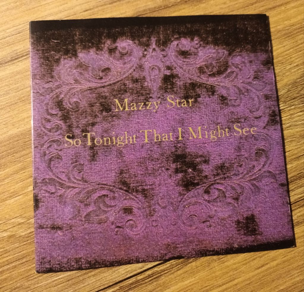 Cover of Mazzy Star's album, So Tonight that I might See'. The cover features an abstract purple and black image. 