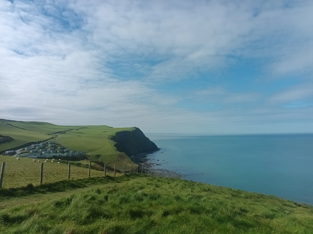 A view of the cliffs looking out across Cardigan Bay on a bright, sunny day